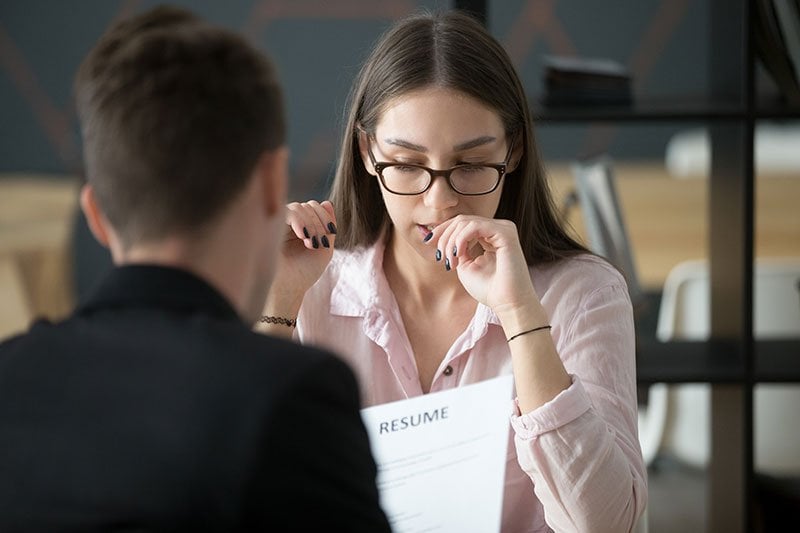 girl sitting at table during interview